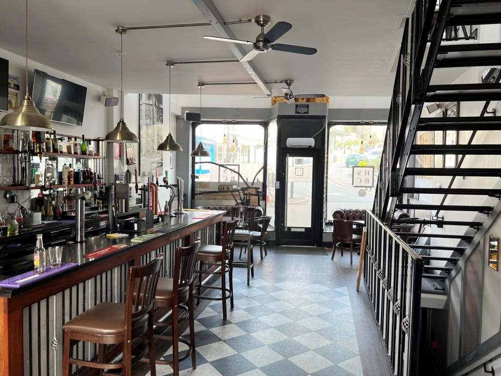 Lot: 173 - TOWN CENTRE FREEHOLD THREE STOREY BAR WITH GARDEN AND PARKING - The main bar looking towards the street